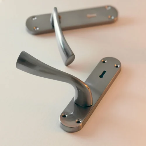 Scimitar Lever And Lock On Backplate Bathroom Door Handle Set - Satin Chrome (122293) -Oak Door Store 1725874471 72734000