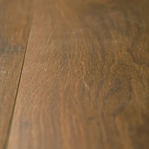 Iris Oak - 8mm Water Resistant Laminate Flooring (62002275) -Oak Door Store SKU 5000006 closeup a470628e e627 46ba 9bf3 a00c8e08499a