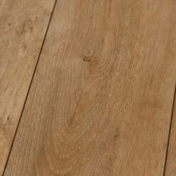 Welsh Oak Nature - 8mm Water-Resistant Laminate Flooring (D4617) 8 Welsh Oak Nature - 8mm Water-Resistant Laminate Flooring (D4617) -Oak Door Store SKU 500010 closeup c11350e2 24d3 4955 a223 54ce206ba5ef